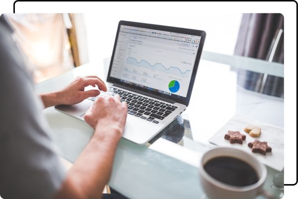 Reviewing a Google Ads dashboard on a laptop